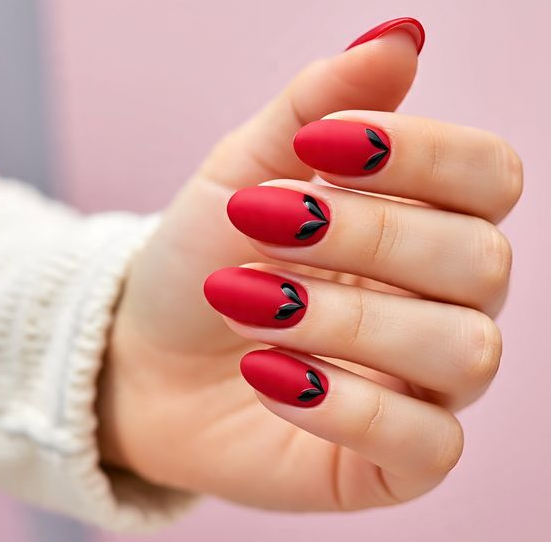 red nails with black design