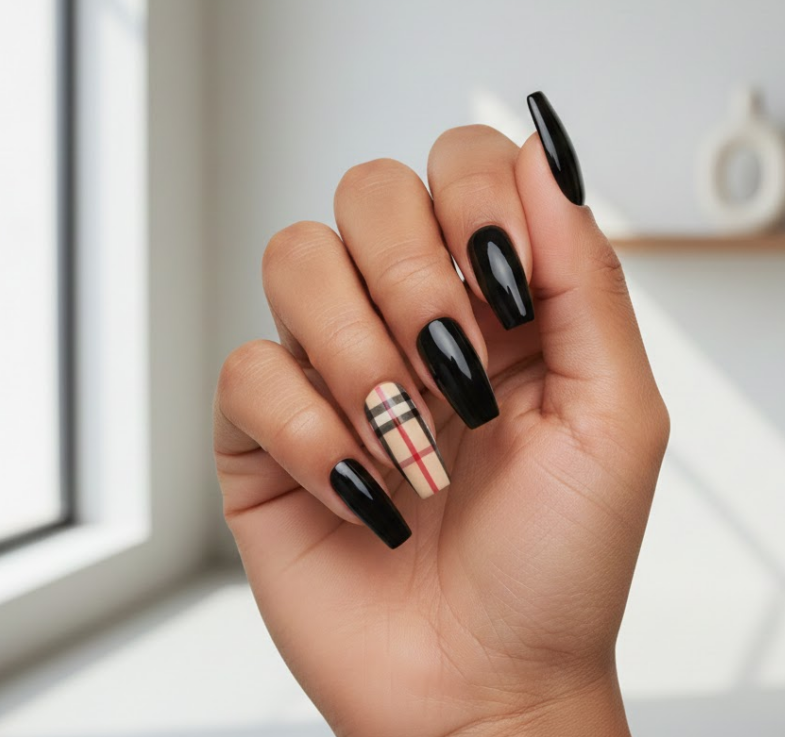 In this design, only one nail has the plaid pattern, and the rest are kept simple in nude or black