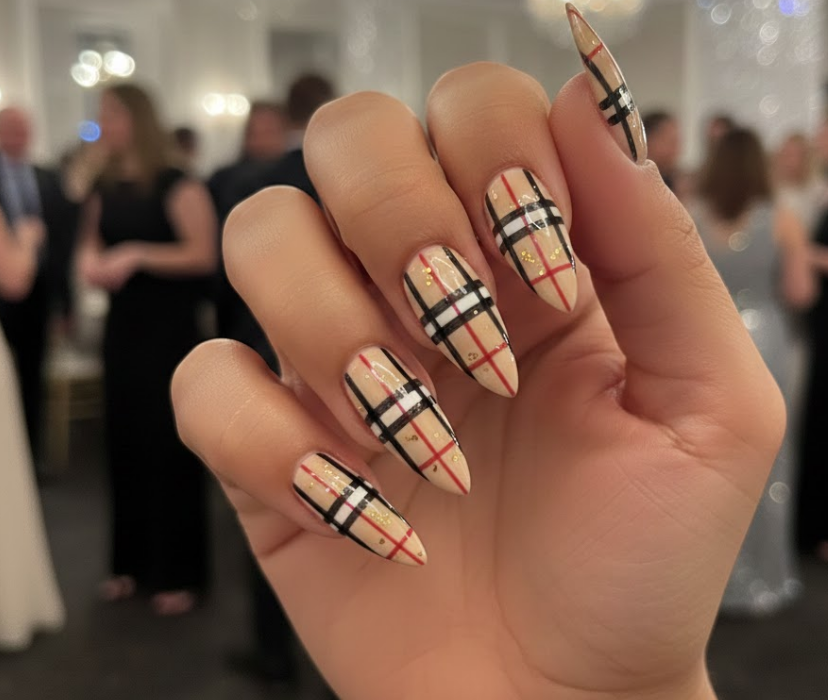This design has a bit of glitter with the plaid, beige base with black and red lines and some golden sparkle