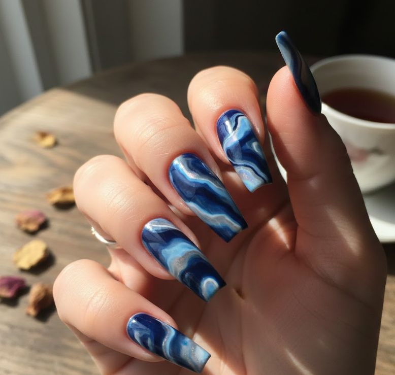 This fun nail designs style has a marble effect with soft swirling patterns, each nail slightly different