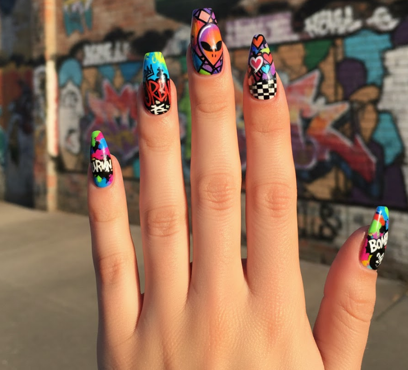 Each nail has a different bright color and graphic pattern, a confetti-like graffiti nails explosion