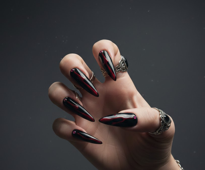 Glossy deep red drips over a clear or black base, edgy and dramatic, perfect gothic-inspired drip nails