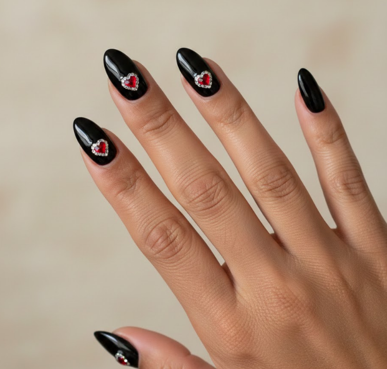 Black nails with hearts made of rhinestones, sparkling and glamorous