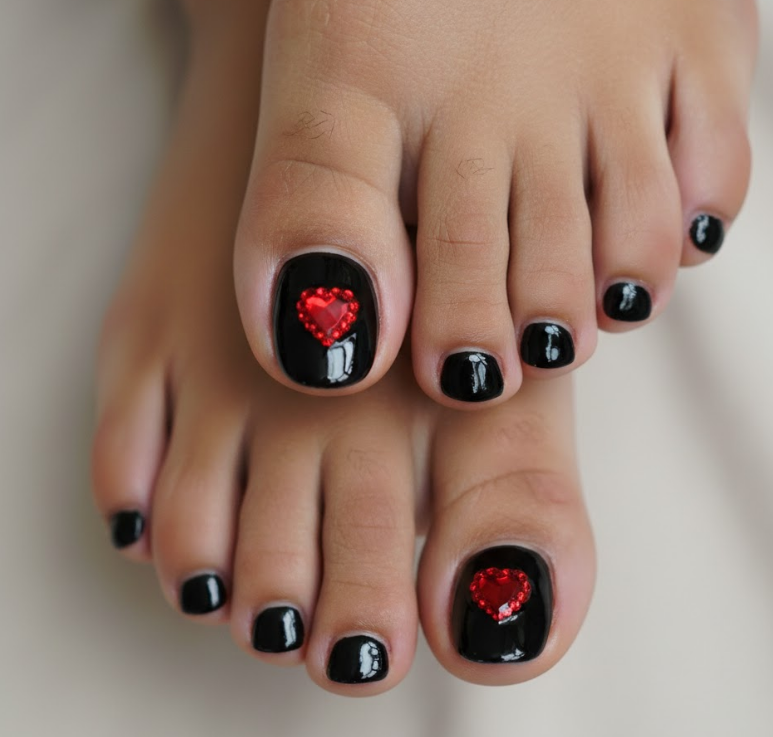 Big toe accented with rhinestone heart over black polish, coordinated luxury look