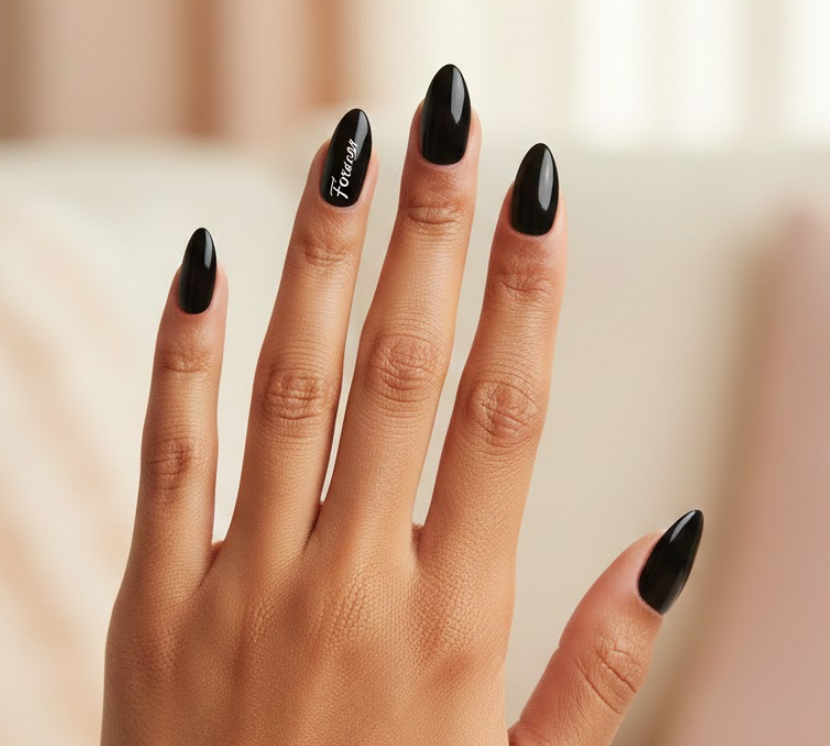 Accent nail shows “Forever” or “Be Mine” on black, personal and sentimental