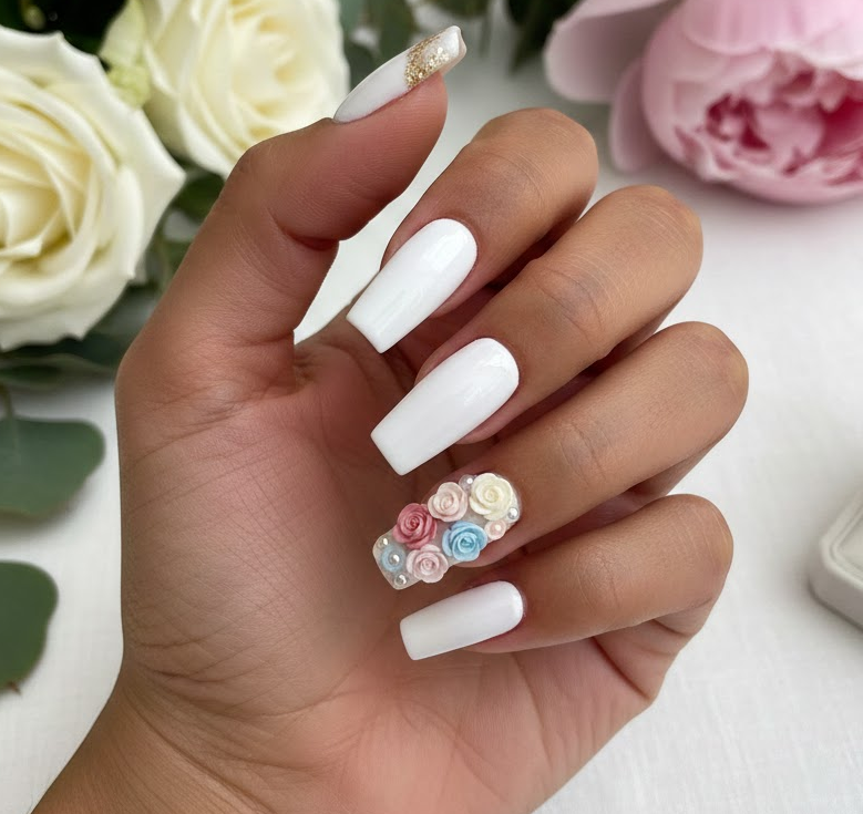 White nails with one accent nail featuring tiny 3D flowers, sculpted and elegant for a proposal-ready look