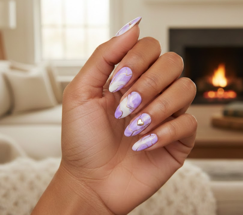 Lilac marble nails with delicate gold veins and a tiny heart accent, classy and elegant