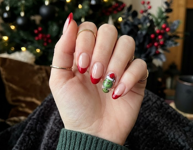 Red tips with Grinch wearing a tiny Santa hat.