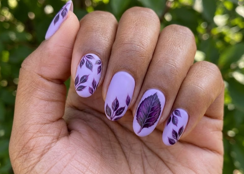 Purple Leaf Plum – Oval shaped nails: Lavender base, dark purple plum leaves, single accent, matte finish, spring nails.