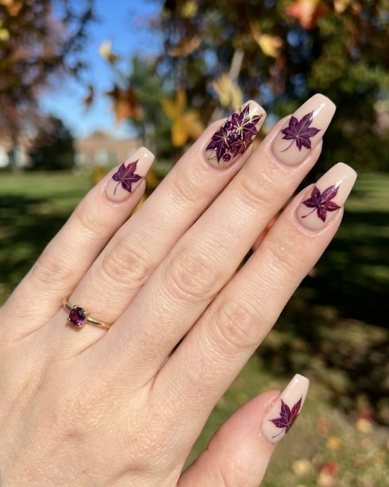 Sweetgum – Coffin shaped nails: Beige base, deep purple/wine star-shaped sweetgum leafs, accent nail, autumn elegance.