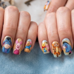 This nail design shows Pooh with all his friends (Piglet, Tigger, Eeyore, Rabbit, and Owl) on different nails, creating a complete cartoon world and a colorful story-like feel.