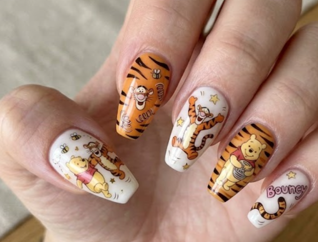 This nail art shows Pooh and Tigger in a bouncing playful pose,