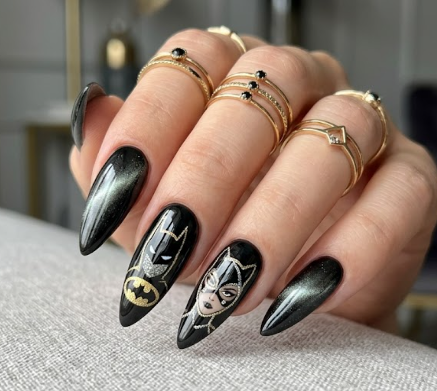 Full hand Batman Catwoman glossy black stiletto nails with cat-eye effects on a simple background