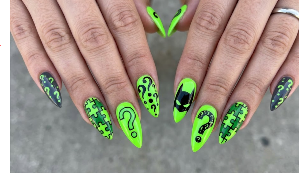 Full hand Batman Riddler neon green nails with question marks and puzzle designs on a simple background