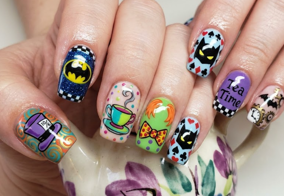 Full hand Batman Mad Hatter whimsical tea party inspired colorful nails on a simple background
