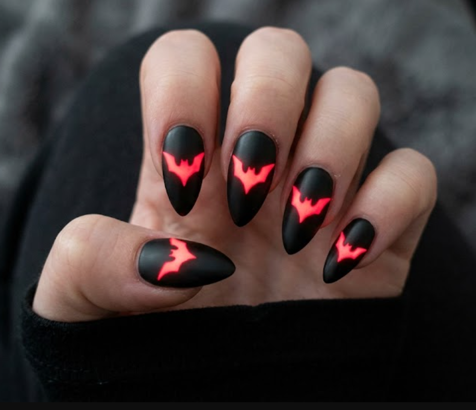 Full hand Batman Beyond cyberpunk black nails with glowing neon red bat symbols on a simple background