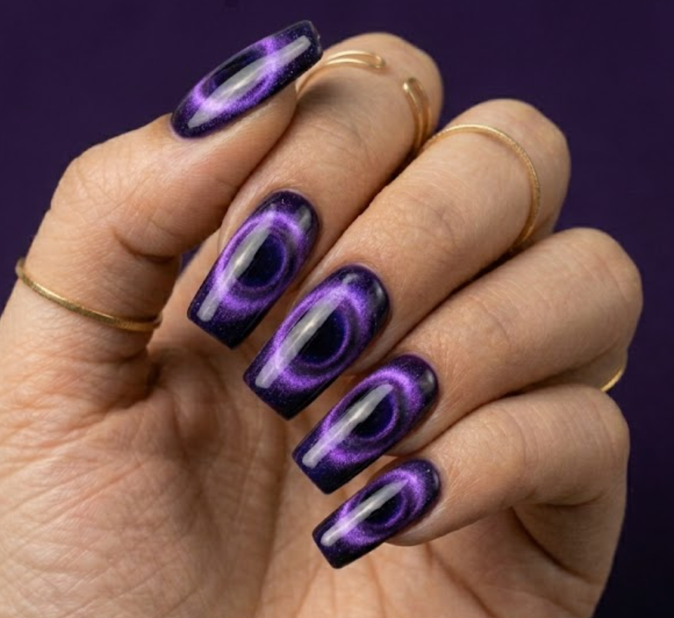 Mountain peak shaped nails using magnetic cat-eye gel polish to create a deep, swirling 3D purple portal effect inspired by Raven's magic.