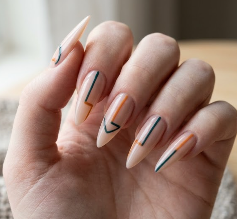 Close-up photo of a woman’s hand with white skin in a straight elegant still pose, thin stiletto-shaped nails.