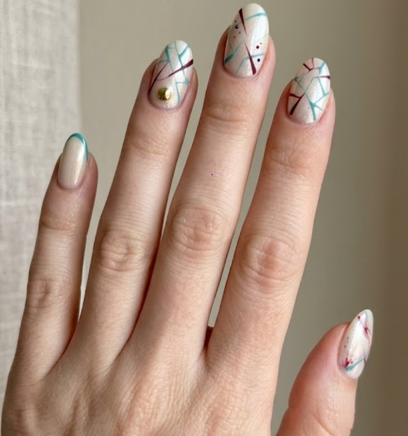 This photo shows full hand Lois Griffin inspired nails with elegant soft tones, classy luxury details, oval nail shape, and simple beige background.