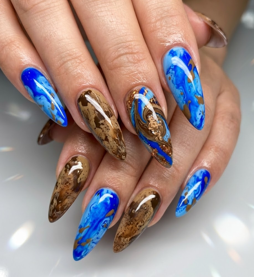 This photo shows full hand Greased-Up Deaf Guy inspired nails with glossy fluid patterns, slippery motion effect, long stiletto nail shape, and simple shiny background.