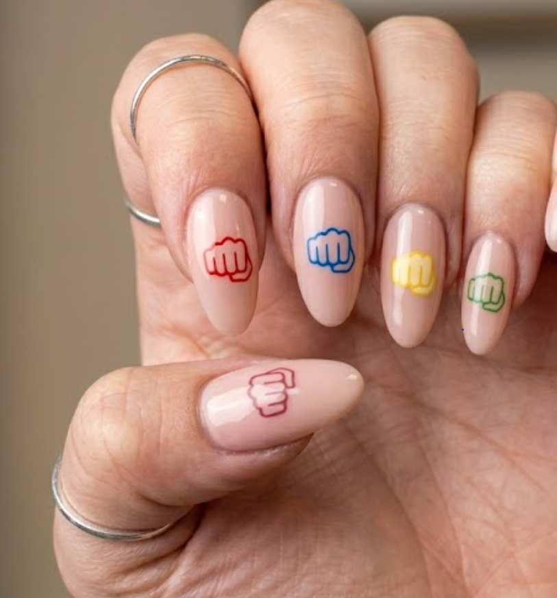 A woman’s hand with Superman punch action design and comic-style impact lines in bold colors.