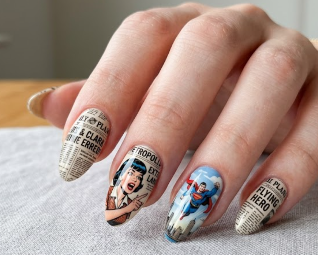A woman’s hand showing newspaper print nails with Lois Lane illustration and Superman flying in the background.