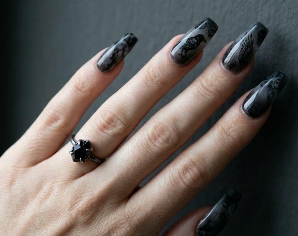 In this picture, coffin-shaped nails show smoky black marble crow nail designs with dark ombré effects.