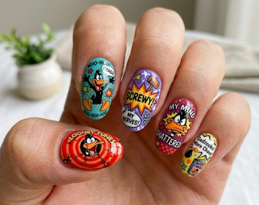 In this photo, playful Daffy Duck Looney Tunes nail art with a cheerful cartoon style.