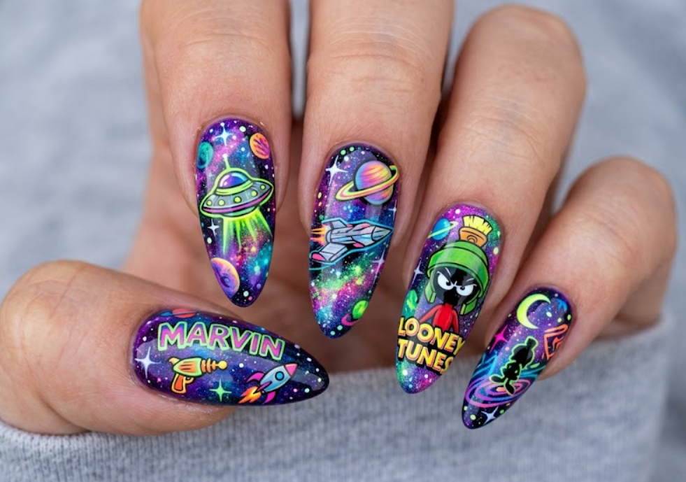 In this photo, fun Marvin the Martian Looney Tunes nail art with cool space-themed cartoon vibes.
