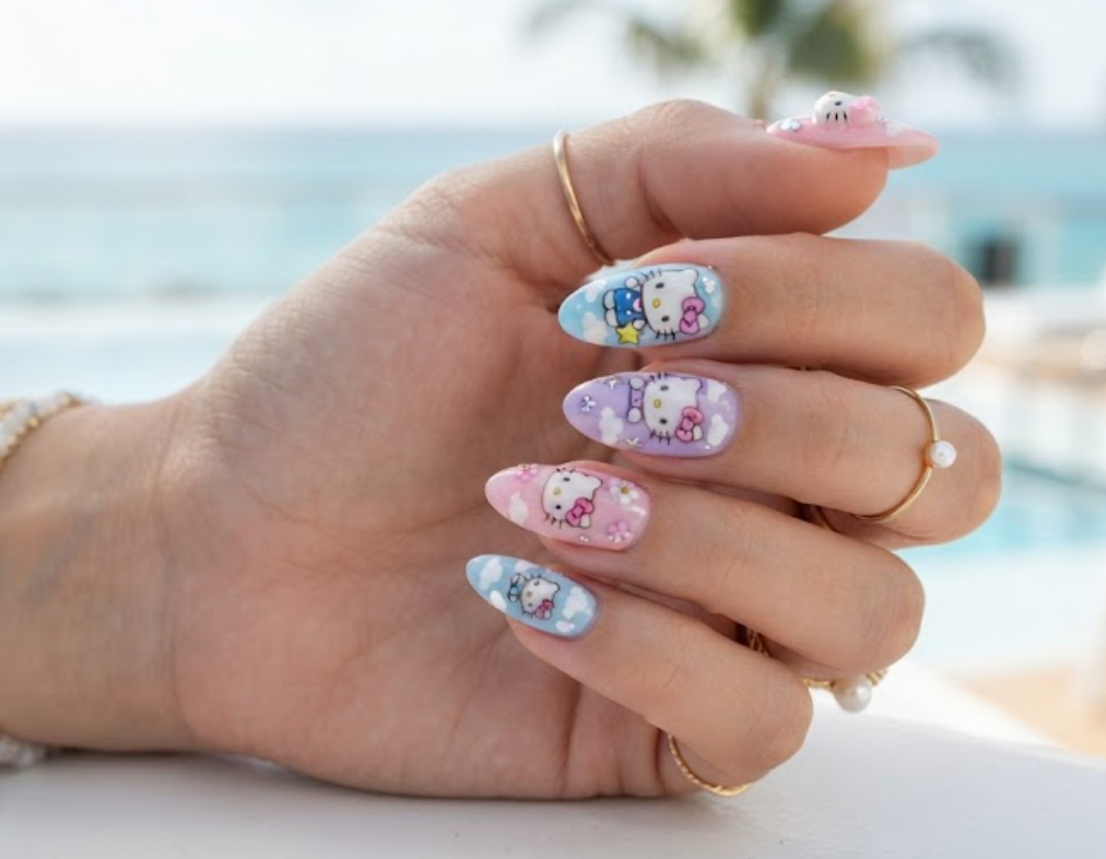 Soft aesthetic nail art featuring Hello Kitty and fluffy mini cloud designs.