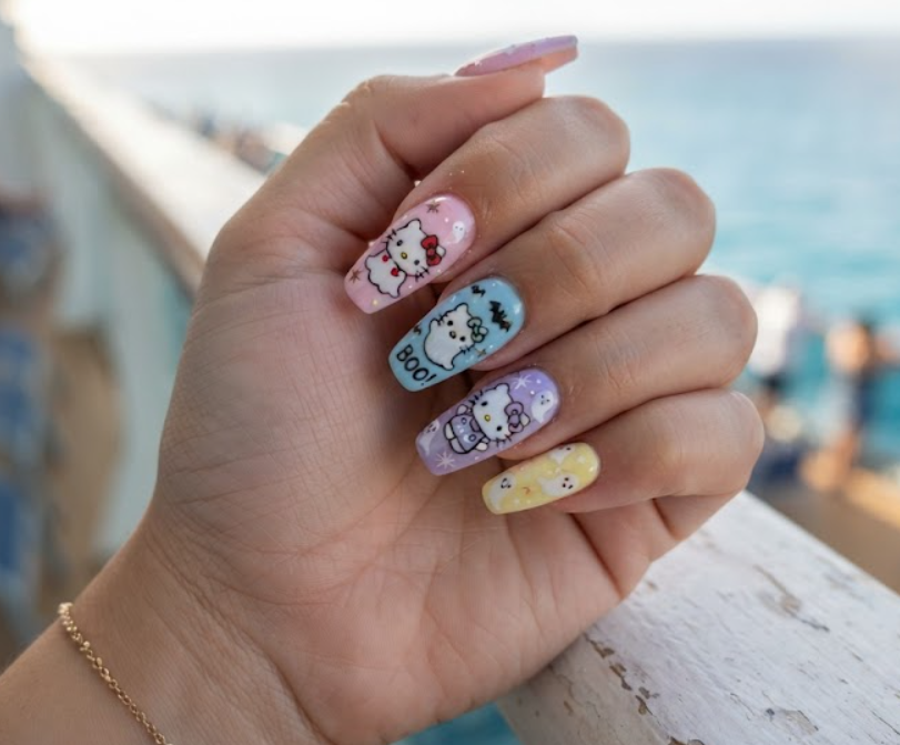 Playful and cute Hello Kitty themed pastel ghost nail art.