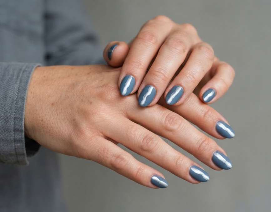 in this image real hands showcase a moonlit river reflection camp nail design. camp inspired nail design