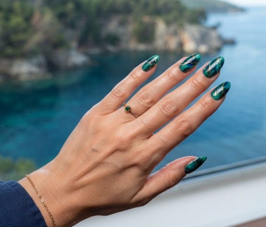 In this image, full hand nails feature Hidden Cove Marble cruise nail ideas.