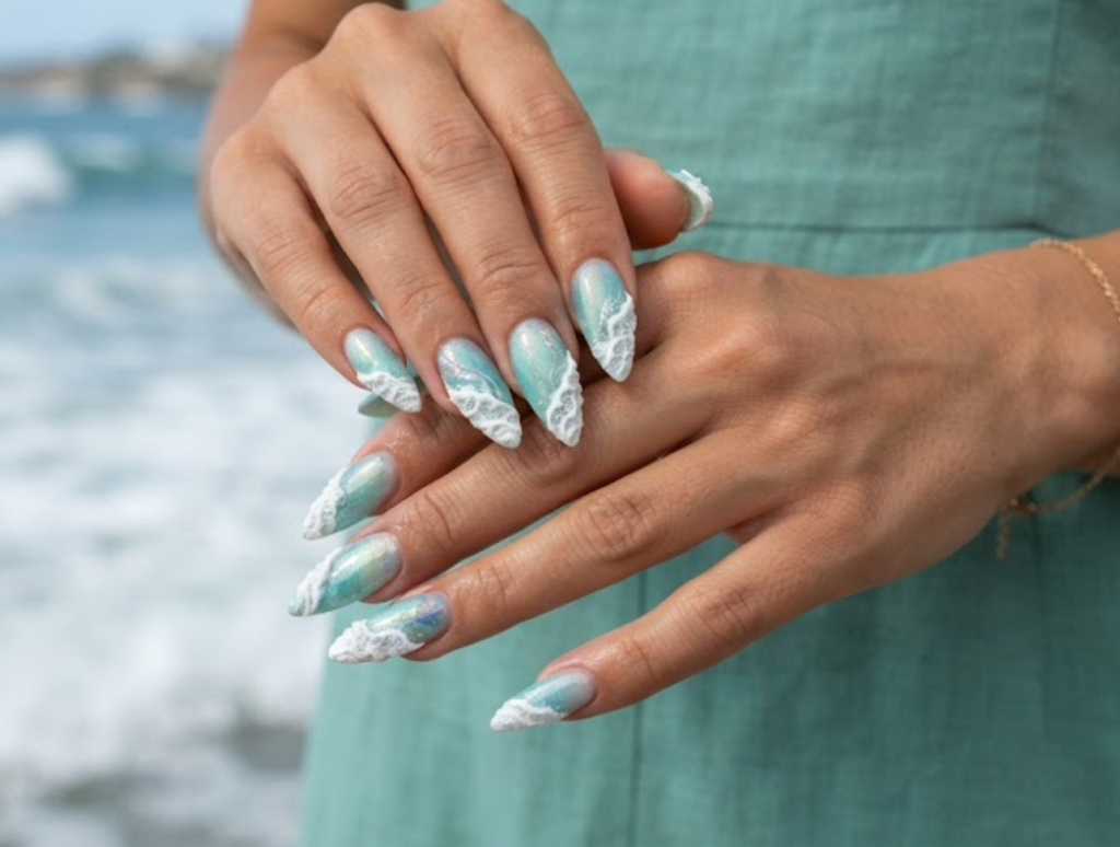 In this image, cruise wedding nails highlight short stiletto seafoam green nails with a sculpted 3D white seafoam edge, worn by hands in a seafoam dress.