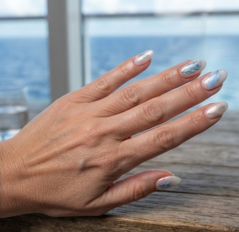 In this image, full hand nails feature Ocean Feather cruise nail ideas.