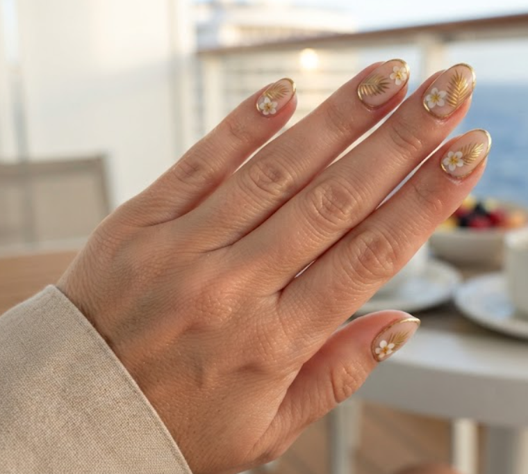 In this image, full hand nails feature Golden Palm Frame cruise nail ideas.