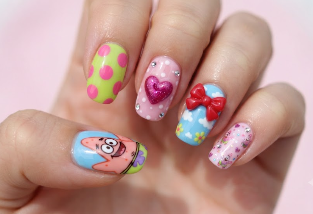 In this photo, Patrick Star and Minnie Mouse come together in a cute nail design with bows, polka dots, hearts, and Disney-inspired details.