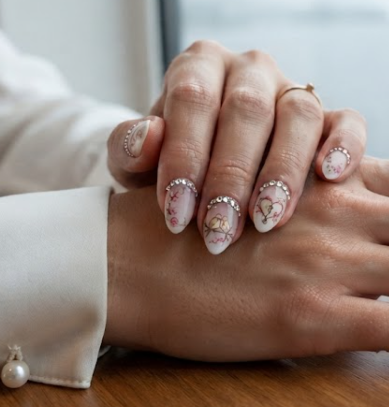 Baby boomer French ombre honeymoon nails featuring a clean crystal-lined cuticle.