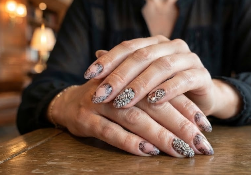 Vibrant coral and yellow sunset ombre honeymoon nails with hand-painted hibiscus flower art and gold glitter.