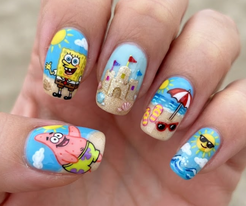 In this photo, Patrick Star and SpongeBob are featured on a fun beach-themed nail set with sandcastles, starfish, and sunny Bikini Bottom details.