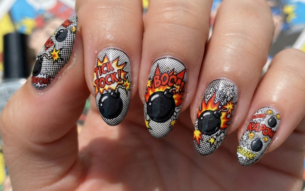 In this image, black and white comic nails feature cartoon bombs, sparks and TICK TOCK lettering.