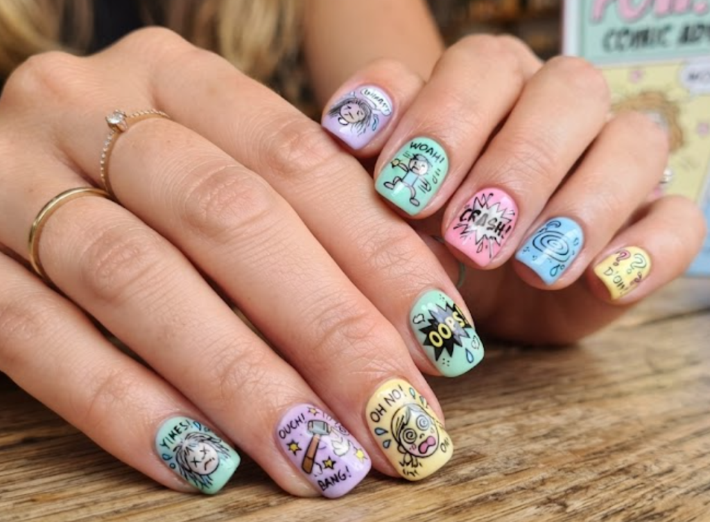 imaIn this image, pastel comic nails feature silly cartoon expressions, mistake effects and OOPS bubbles.