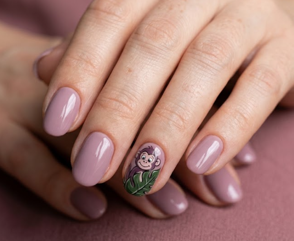 In this image, lemon yellow nails with a cartoon monkey and coconut tree