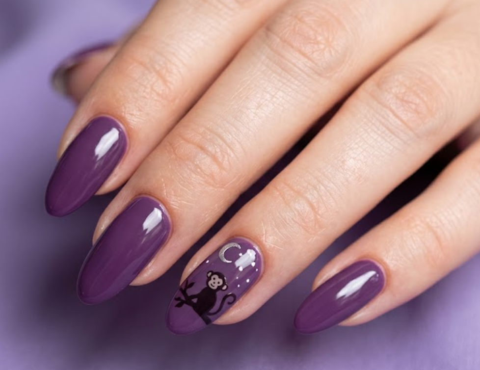 In this image, grape purple nails with a moonlit cartoon monkey