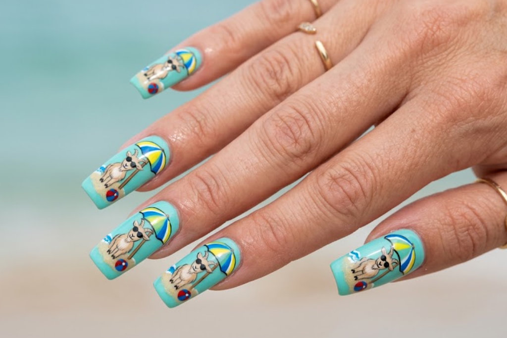 In this image, aqua nails with a cartoon goat relaxing at the beach