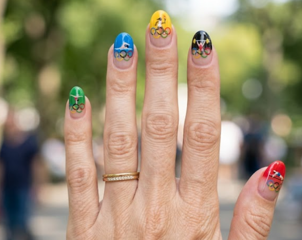In this image, Olympic nails featuring colourful Olympic rings and athletic details.