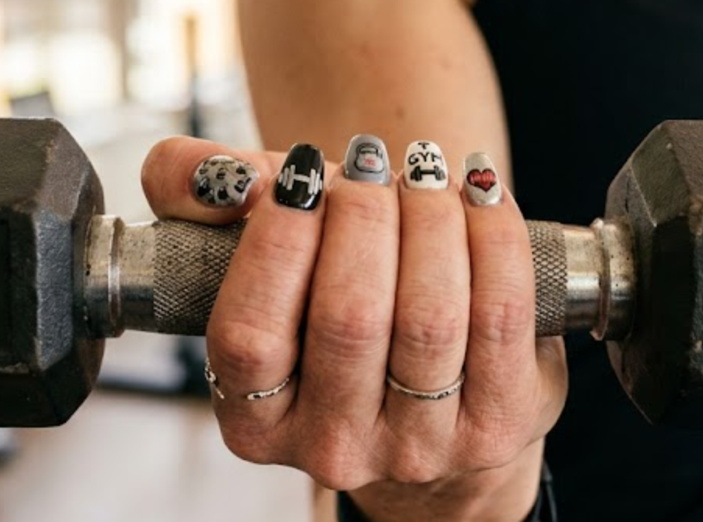 In this image, gym workout nails featuring dumbbells, barbells, weights, and fitness equipment.