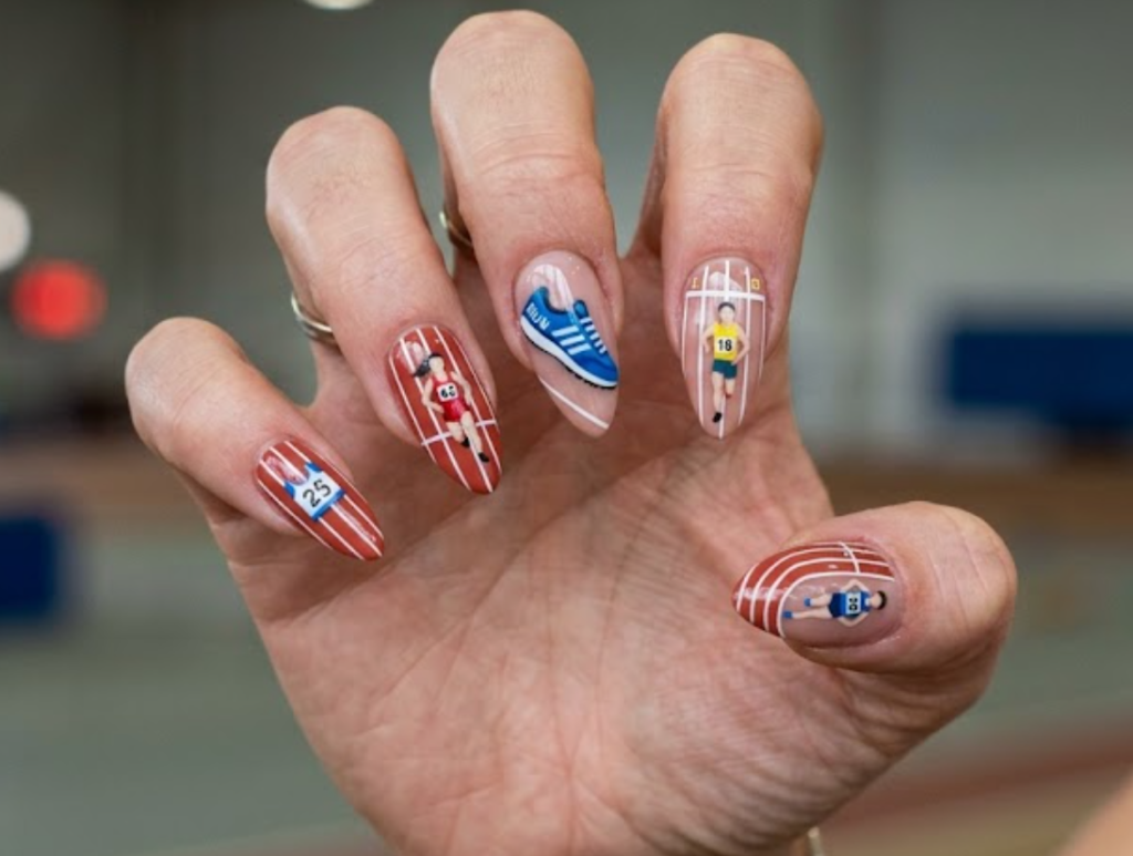In this image, track and field nails featuring running tracks, racing numbers, running shoes, and athletes.