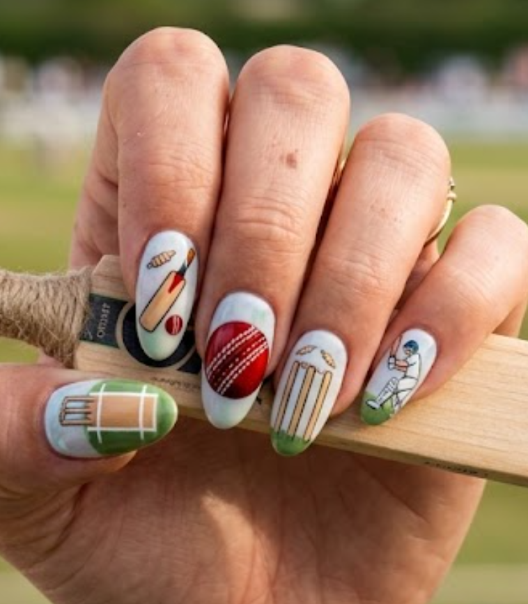 In this image, cricket nails featuring red cricket balls, cricket bats, wickets, and stitching details.
