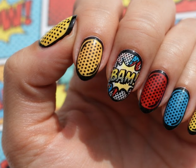In this image, bright comic nails feature BAM lettering, colourful blocks and halftone dots.
